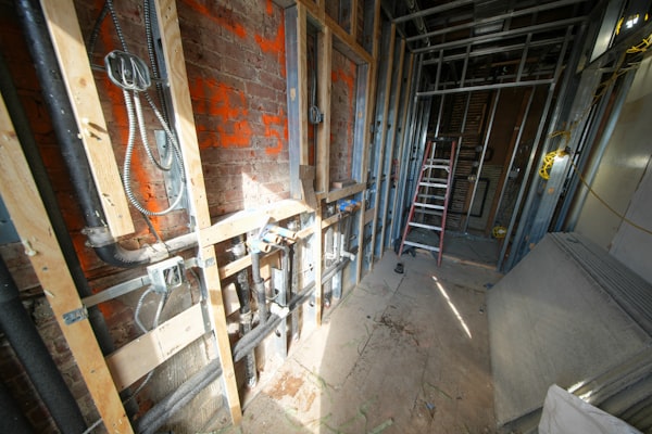 Exposed plumbing pipes during residential leak detection inspection