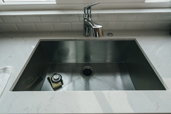 Kitchen sink with modern faucet