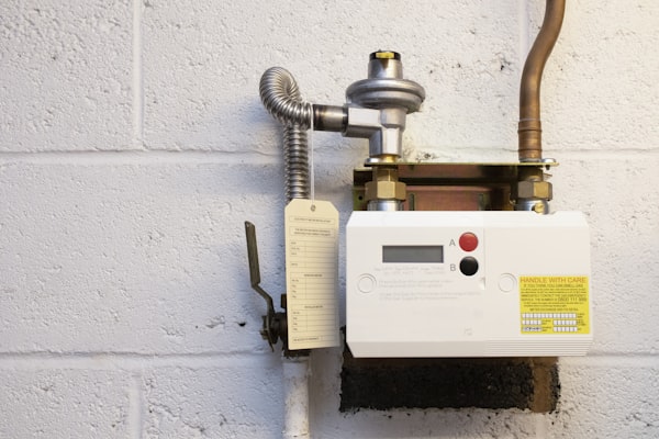 Residential water heater unit mounted on wall